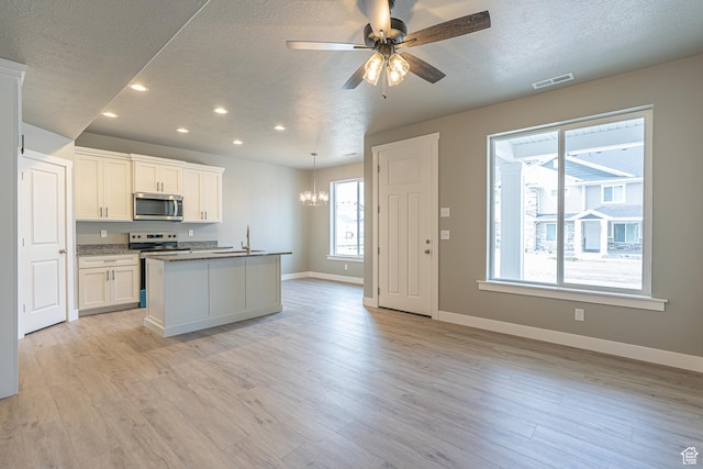 2206 S 1120 W Unit 65, Nibley, UT 84321 - kitchen featuring stainless steel appliances, a textured ceiling, recessed lighting, a chandelier, and ceiling fan