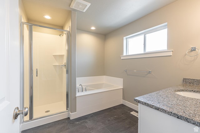 2206 S 1120 W Unit 65, Nibley, UT 84321 - bathroom featuring a garden tub, a shower stall, vanity, and recessed lighting