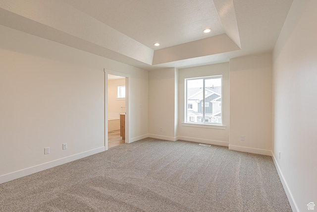 2214 S 1120 W Unit 67, Nibley, UT 84321 - unfurnished room with light colored carpet, a tray ceiling, and recessed lighting