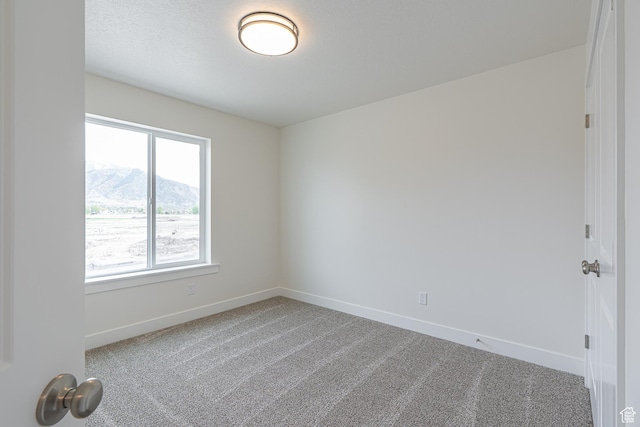 2214 S 1120 W Unit 67, Nibley, UT 84321 - carpeted spare room with baseboards and a mountain view