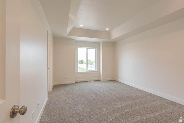 2214 S 1120 W Unit 67, Nibley, UT 84321 - unfurnished room featuring a tray ceiling, light colored carpet, a textured ceiling, and recessed lighting