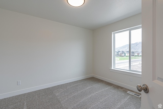 2214 S 1120 W Unit 67, Nibley, UT 84321 - empty room with healthy amount of natural light, light colored carpet, and a mountain view
