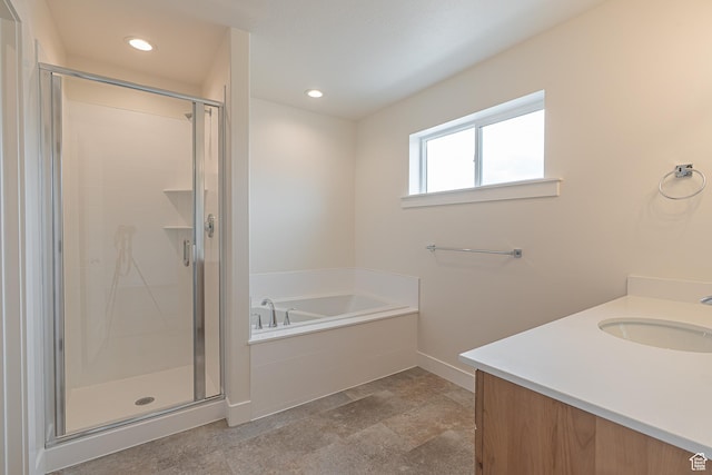 2214 S 1120 W Unit 67, Nibley, UT 84321 - bathroom featuring a garden tub, vanity, a shower stall, and recessed lighting