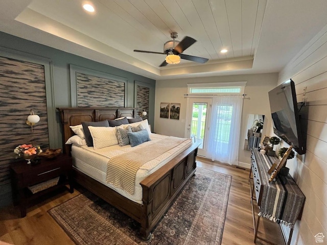 4053 W 3770 S, Wellsville, UT 84339 - bedroom featuring a tray ceiling, access to exterior, wood finished floors, ceiling fan, and recessed lighting