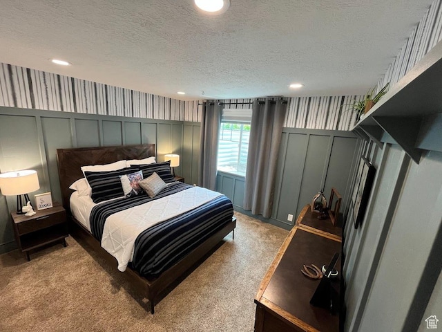 4053 W 3770 S, Wellsville, UT 84339 - bedroom with a decorative wall, light colored carpet, a textured ceiling, and recessed lighting