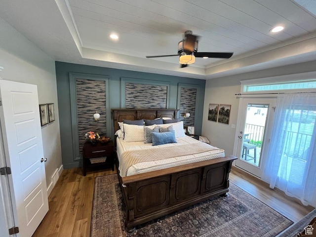 4053 W 3770 S, Wellsville, UT 84339 - bedroom with a tray ceiling, access to exterior, light wood finished floors, and a ceiling fan