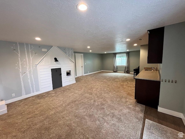 4053 W 3770 S, Wellsville, UT 84339 - basement with a textured ceiling, recessed lighting, light colored carpet, and a fireplace