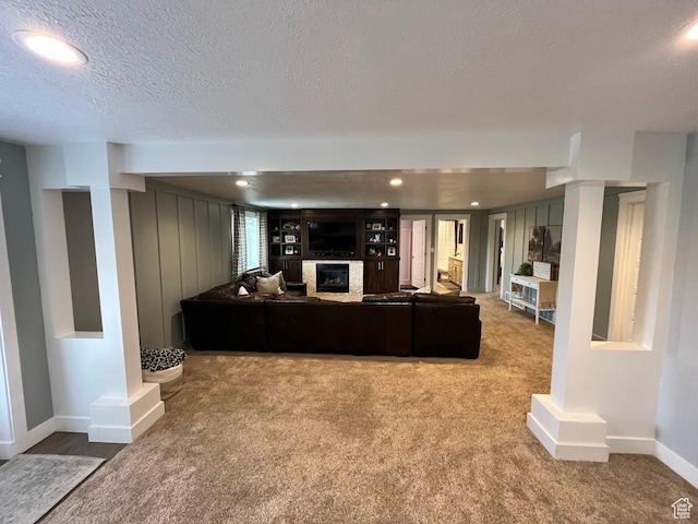 4053 W 3770 S, Wellsville, UT 84339 - living room with a glass covered fireplace, a textured ceiling, carpet, and recessed lighting