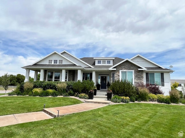 4053 W 3770 S, Wellsville, UT 84339 - craftsman-style home with a front yard and stone siding