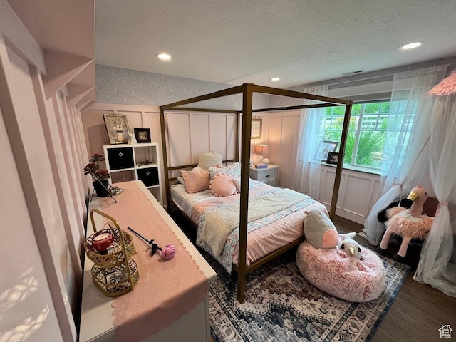 4053 W 3770 S, Wellsville, UT 84339 - bedroom featuring wood finished floors, a decorative wall, and recessed lighting