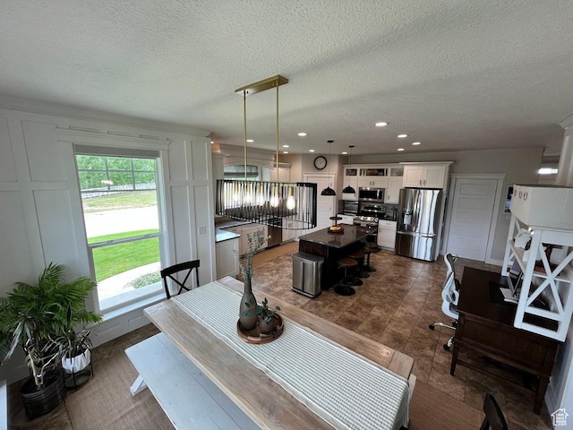 4053 W 3770 S, Wellsville, UT 84339 - dining room featuring a textured ceiling and recessed lighting