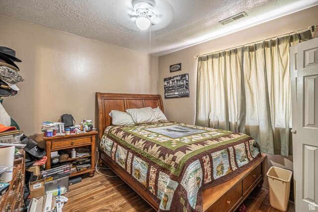 737 Carma Way, Washington, UT 84780 - bedroom featuring wood finished floors and a textured ceiling