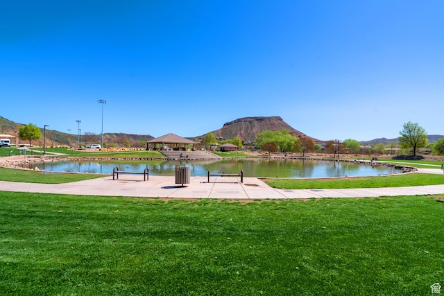 737 Carma Way, Washington, UT 84780 - view of property's community with a lawn and a water and mountain view