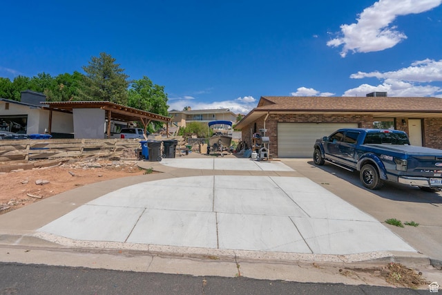 737 Carma Way, Washington, UT 84780 - view of front of home with driveway, a garage, and brick siding