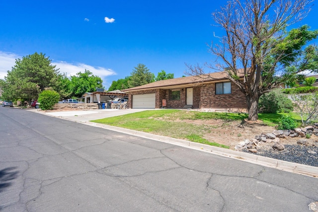 737 Carma Way, Washington, UT 84780 - single story home with a garage, concrete driveway, and brick siding