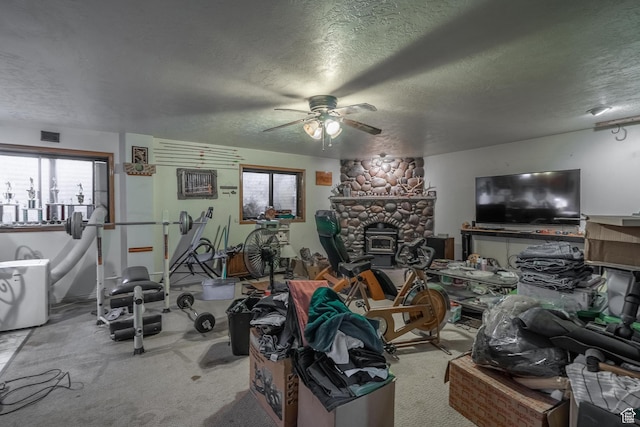 737 Carma Way, Washington, UT 84780 - living room featuring a textured ceiling, ceiling fan, carpet floors, and a fireplace