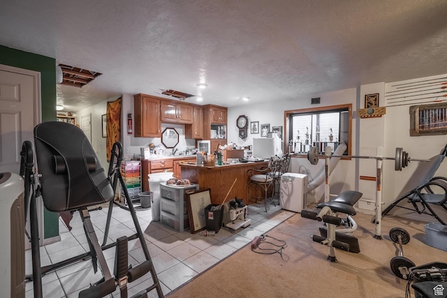737 Carma Way, Washington, UT 84780 - exercise area featuring a textured ceiling and light tile patterned flooring