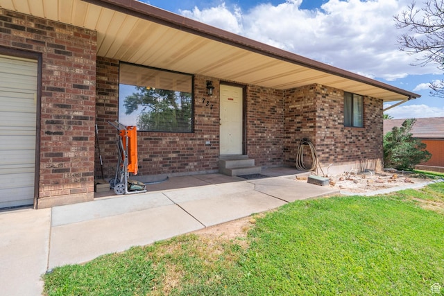 737 Carma Way, Washington, UT 84780 - property entrance featuring brick siding and a yard