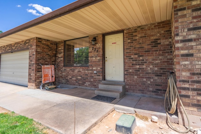 737 Carma Way, Washington, UT 84780 - entrance to property featuring brick siding and a garage
