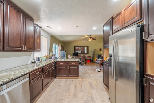 737 Carma Way, Washington, UT 84780 - kitchen featuring appliances with stainless steel finishes, ceiling fan, light wood-style floors, a textured ceiling, and open floor plan