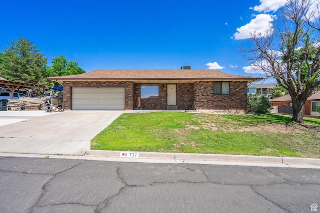 737 Carma Way, Washington, UT 84780 - single story home with a garage, driveway, brick siding, and a front yard