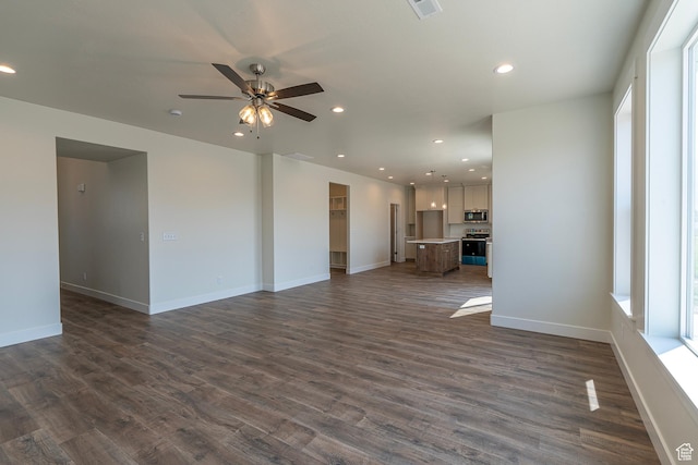 2281 S 1050 W Unit 97, Nibley, UT 84321 - unfurnished living room featuring a ceiling fan, dark wood finished floors, and recessed lighting