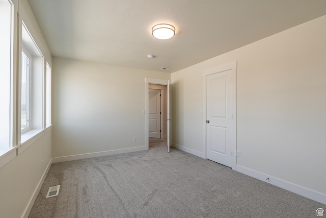 2281 S 1050 W Unit 97, Nibley, UT 84321 - unfurnished room with carpet flooring and a smoke detector
