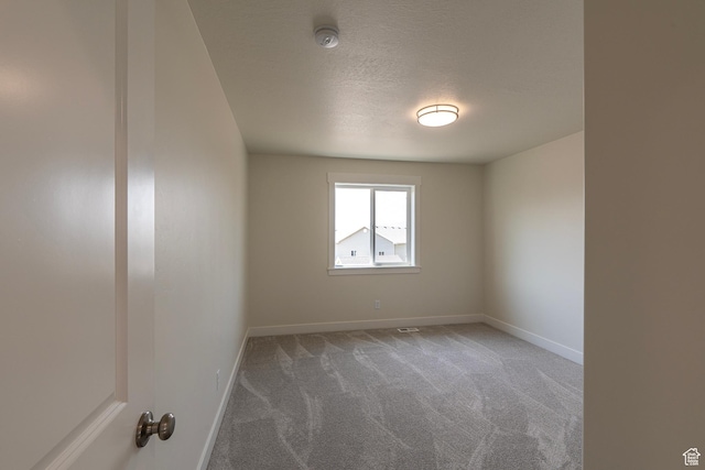 2281 S 1050 W Unit 97, Nibley, UT 84321 - empty room with carpet floors, a smoke detector, and a textured ceiling