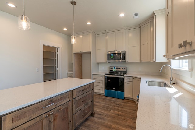 2281 S 1050 W Unit 97, Nibley, UT 84321 - kitchen featuring stainless steel appliances, light stone countertops, dark wood finished floors, recessed lighting, and hanging light fixtures