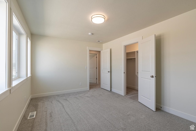 2281 S 1050 W Unit 97, Nibley, UT 84321 - unfurnished bedroom featuring carpet floors, a spacious closet, and a closet