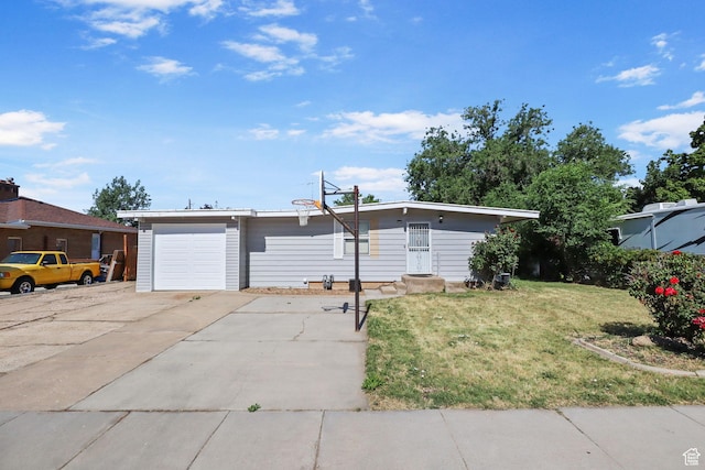 6033 S 2100 W, Roy, UT 84067 - view of front of house with a front lawn, concrete driveway, and a garage