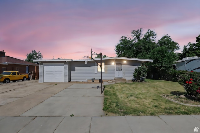 6033 S 2100 W, Roy, UT 84067 - single story home with a lawn, concrete driveway, and an attached garage