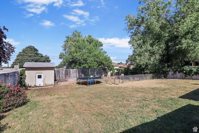 6033 S 2100 W, Roy, UT 84067 - fenced backyard featuring a trampoline and a storage shed