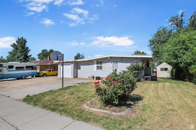 6033 S 2100 W, Roy, UT 84067 - view of front of property featuring a front lawn, concrete driveway, and an attached garage
