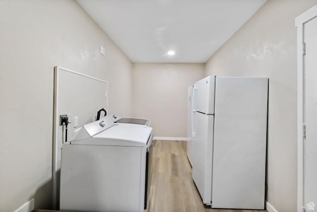 6033 S 2100 W, Roy, UT 84067 - laundry room featuring independent washer and dryer and light wood-style flooring