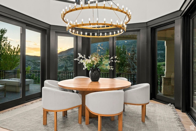 1643 E Box Elder Dr, Alpine, UT 84004 - dining space featuring a chandelier, wood finished floors, a mountain view, and french doors