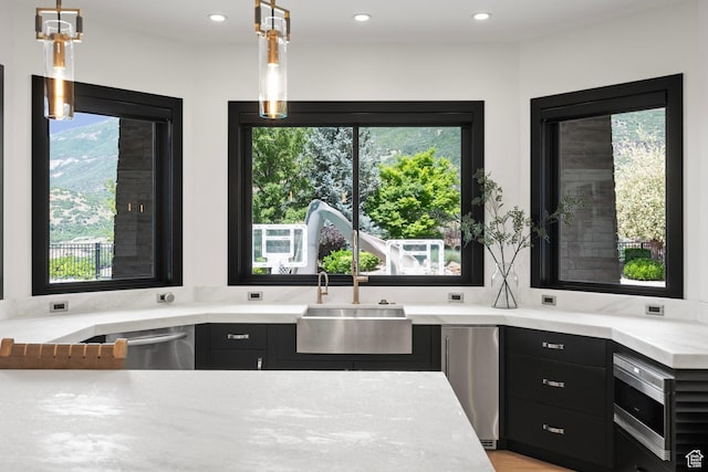 1643 E Box Elder Dr, Alpine, UT 84004 - kitchen featuring appliances with stainless steel finishes, dark cabinets, recessed lighting, and decorative light fixtures