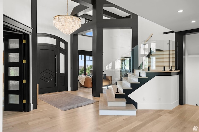 1643 E Box Elder Dr, Alpine, UT 84004 - foyer entrance featuring a chandelier, wood finished floors, stairway, and recessed lighting