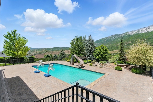 1643 E Box Elder Dr, Alpine, UT 84004 - view of swimming pool with a water slide, a mountain view, and a patio area
