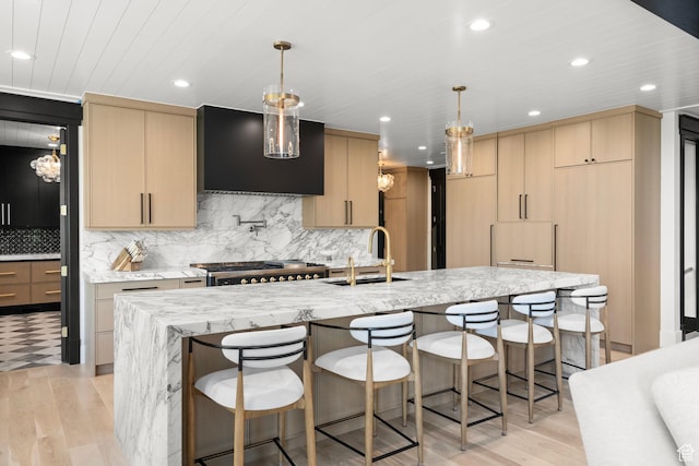 1643 E Box Elder Dr, Alpine, UT 84004 - kitchen featuring ventilation hood, light brown cabinetry, light wood-type flooring, light stone counters, and recessed lighting