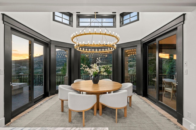 1643 E Box Elder Dr, Alpine, UT 84004 - dining room featuring a chandelier, healthy amount of natural light, and a high ceiling