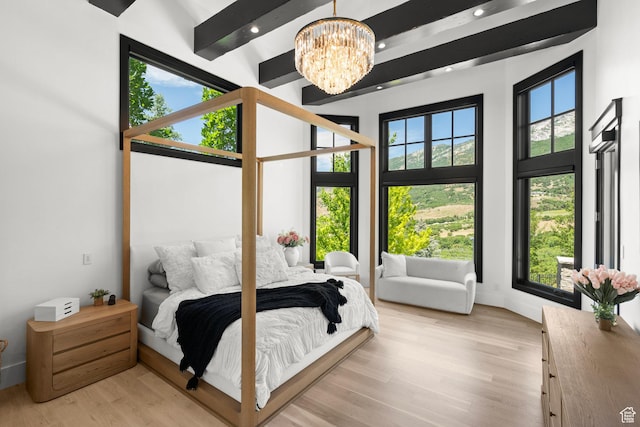 1643 E Box Elder Dr, Alpine, UT 84004 - bedroom featuring a chandelier, light wood-type flooring, recessed lighting, and a towering ceiling