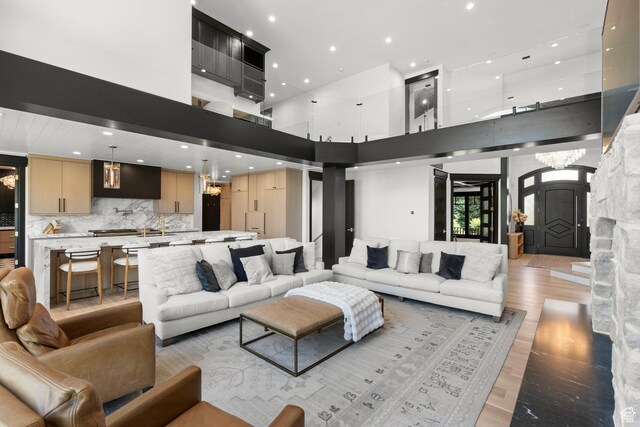1643 E Box Elder Dr, Alpine, UT 84004 - living room with light wood-style flooring, a high ceiling, and recessed lighting