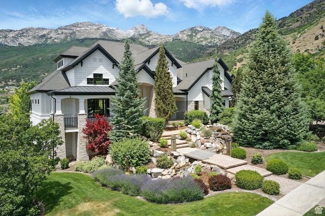 1643 E Box Elder Dr, Alpine, UT 84004 - craftsman-style house featuring a standing seam roof, stone siding, a mountain view, a metal roof, and a front yard