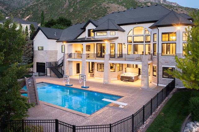 1643 E Box Elder Dr, Alpine, UT 84004 - rear view of house featuring a patio, a fenced backyard, stairs, and a balcony