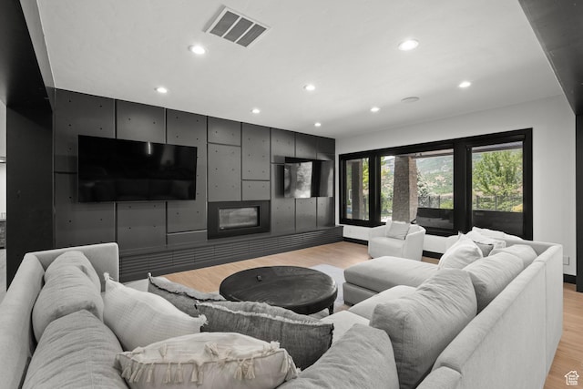 1643 E Box Elder Dr, Alpine, UT 84004 - living room with recessed lighting, light wood finished floors, and a glass covered fireplace