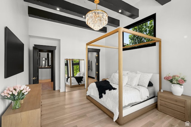 1643 E Box Elder Dr, Alpine, UT 84004 - bedroom with a chandelier, light wood finished floors, and beamed ceiling