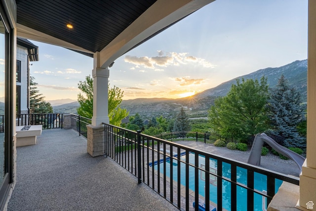 1643 E Box Elder Dr, Alpine, UT 84004 - balcony at dusk with a mountain view and view of pool area