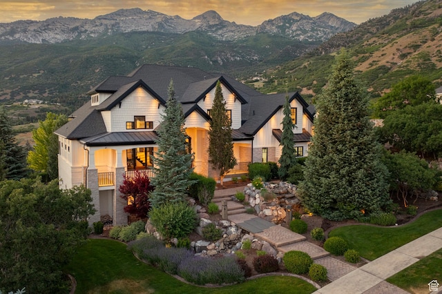 1643 E Box Elder Dr, Alpine, UT 84004 - view of front of house featuring a standing seam roof, a mountain view, a metal roof, and stone siding