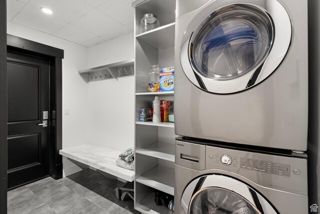 1643 E Box Elder Dr, Alpine, UT 84004 - laundry area featuring stacked washer and clothes dryer, light tile patterned floors, and recessed lighting